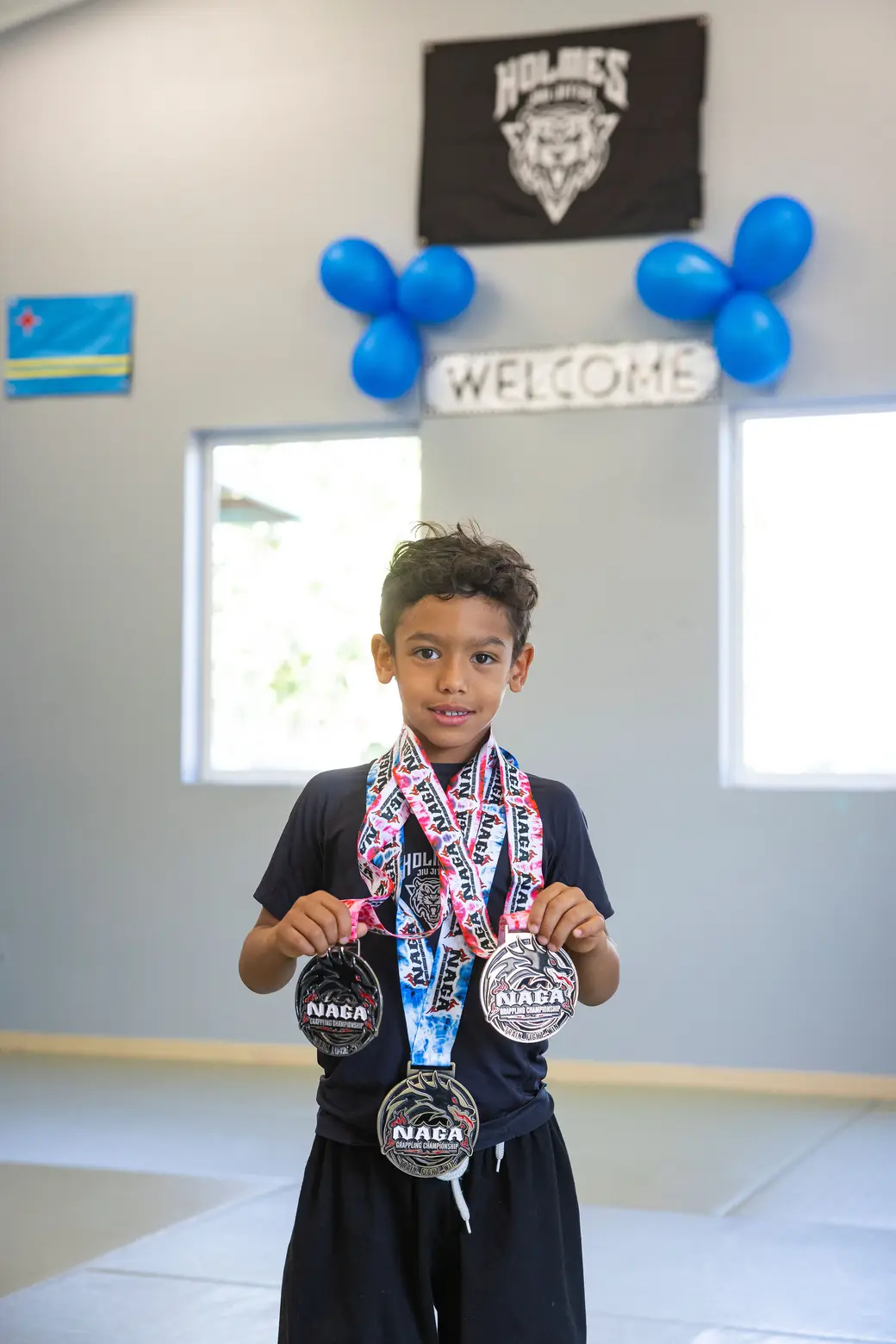 Holmes student with medals